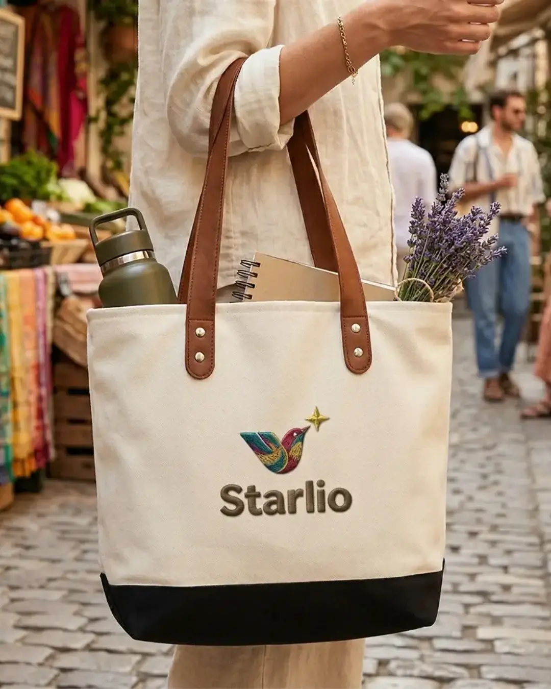 Branded canvas tote with leather handles styled for corporate event — lifestyle