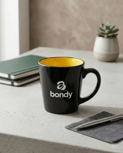 Custom latte mugs in glossy black with a printed logo, mockup