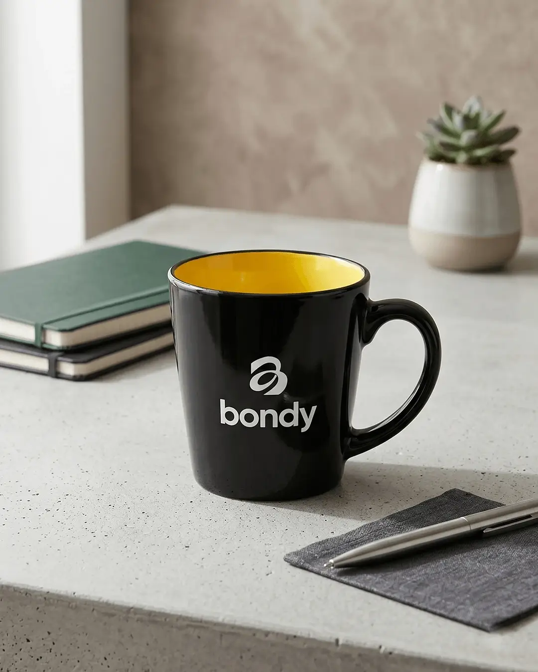 Custom latte mugs in glossy black with a printed logo, mockup