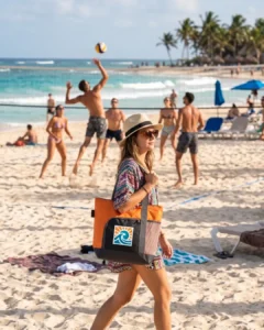 Custom zippered beach bag with a sample logo carried on the sand