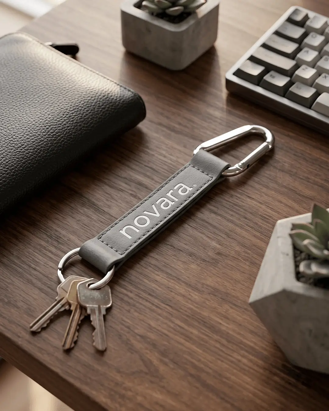Custom lanyard keychain mockup, gray strap with carabiner and key ring on a desk with keys