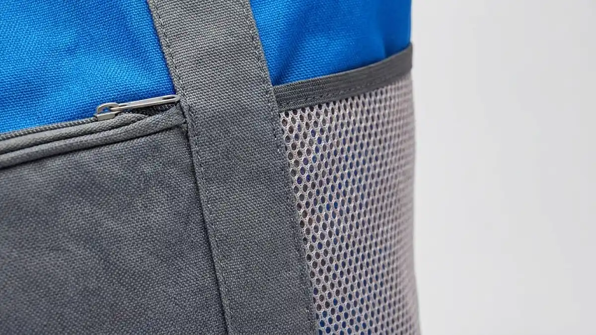 Two-tone 600D polyester canvas and air-mesh panel detail of a custom beach tote bag — Brandevois