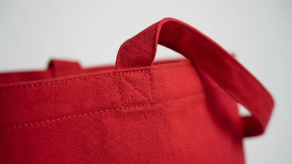 Reinforced carry strap with box stitching on a custom cotton canvas grocery tote bag — Brandevois