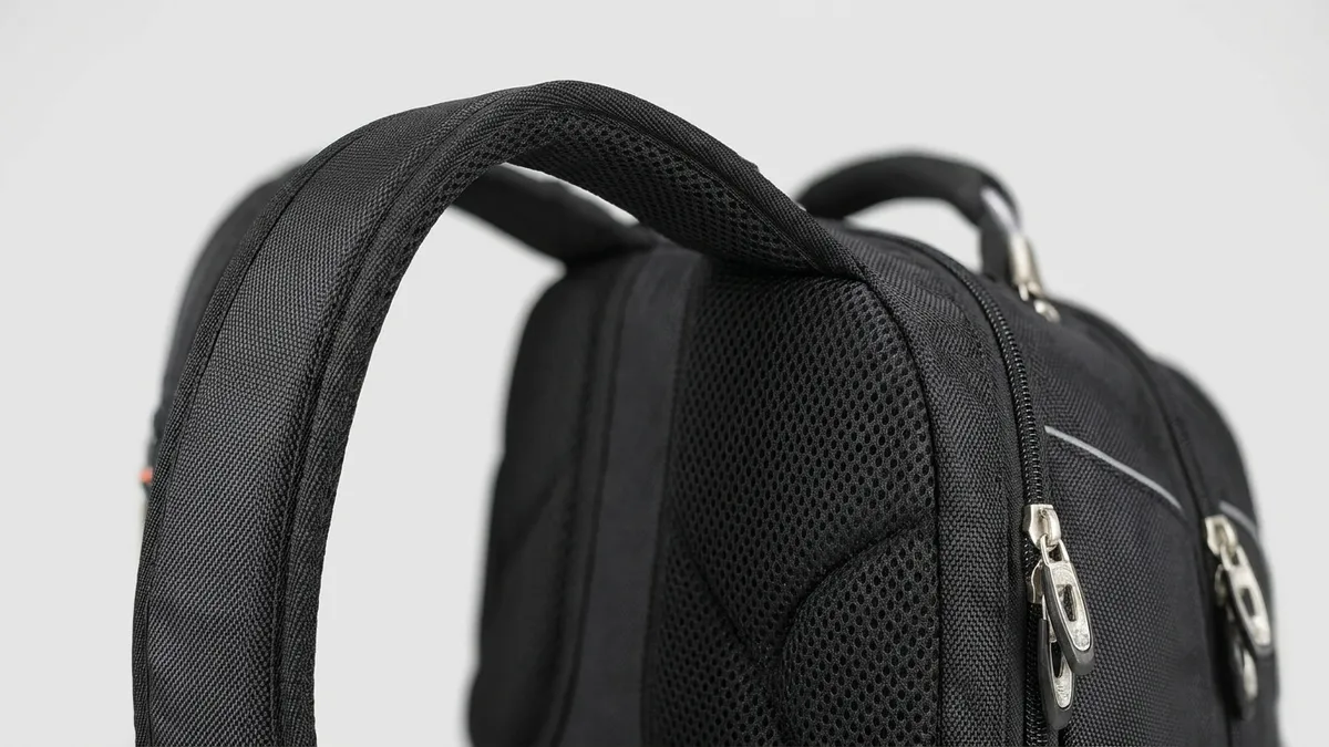Padded shoulder strap and airflow mesh back panel of a custom laptop backpack — Brandevois