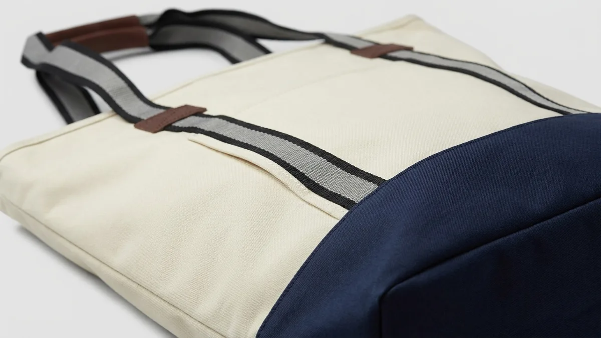 Two-tone navy contrast base and front pocket detail on a custom polyester tote bag — Brandevois
