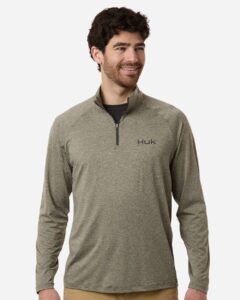Custom embroidered quarter zips in Heather Moss, HUK Airweight heather pullover, on-model front