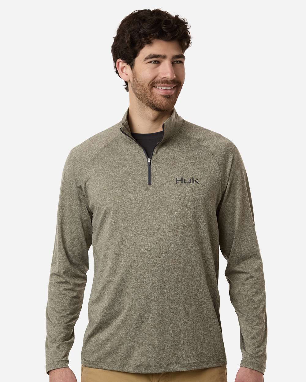 Custom embroidered quarter zips in Heather Moss, HUK Airweight heather pullover, on-model front
