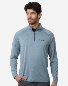 Custom embroidered quarter zips in Silverblue Heather, HUK Airweight heather pullover, on-model front
