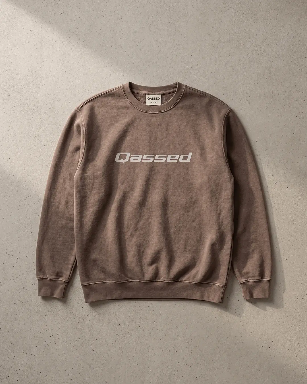 Custom crewneck sweatshirts, Comfort Colors garment-dyed crewneck in Espresso with a printed chest wordmark, flat lay