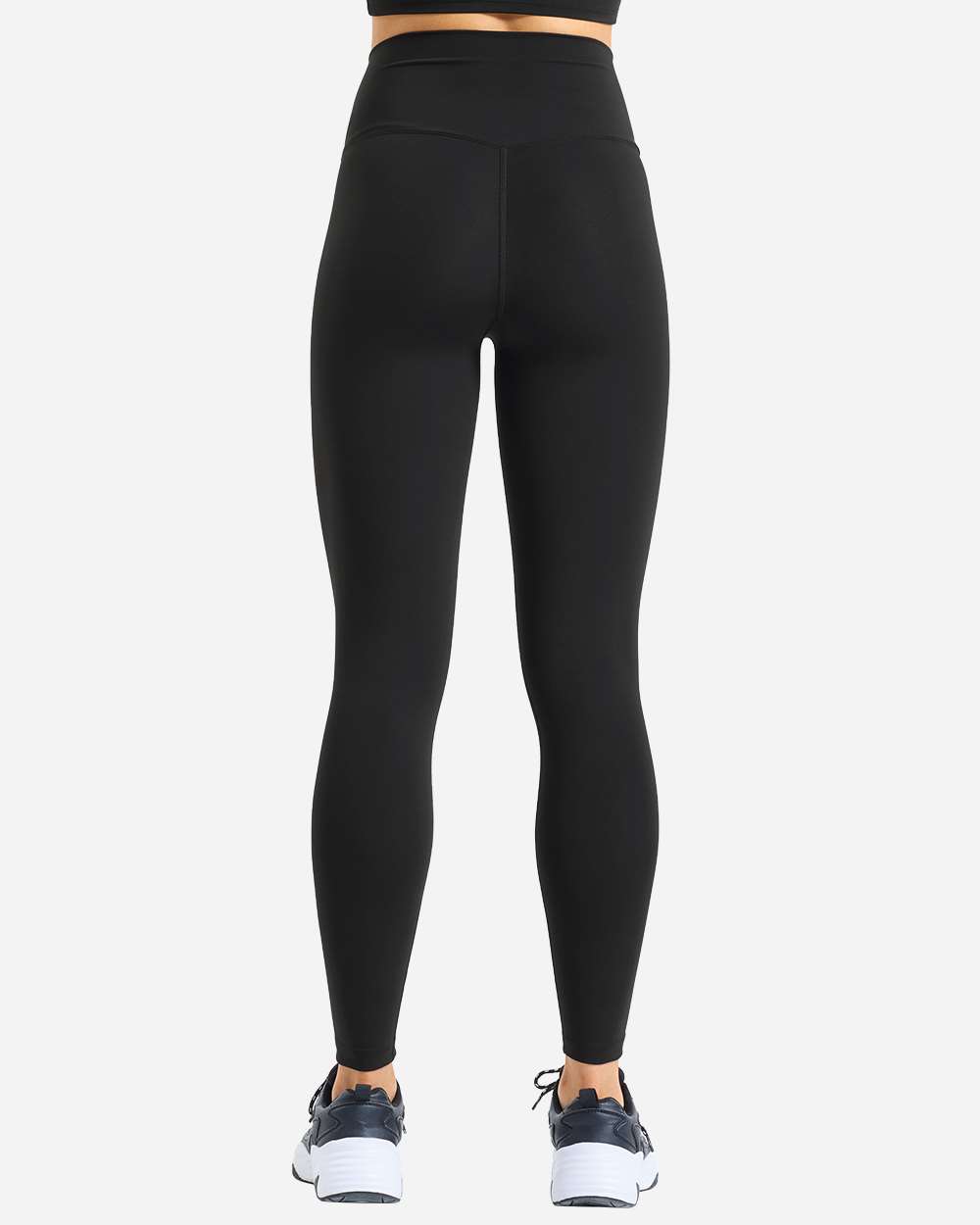 Model wearing custom leggings in Black from the back, showing the full-length fit and opaque matte fabric