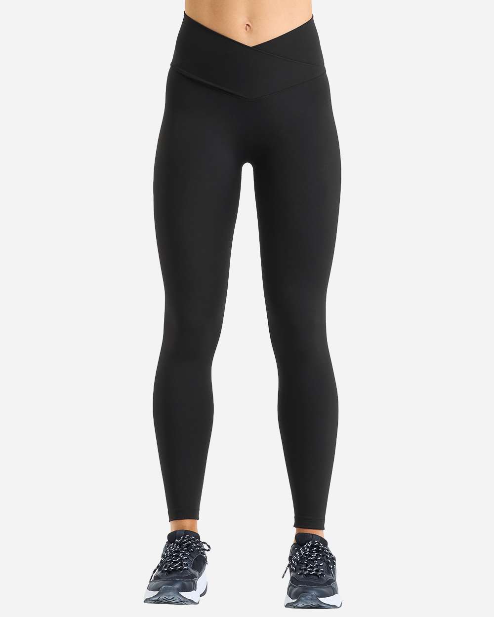 Model wearing custom leggings in Black from the front, showing the high rise and crossover waistband fit