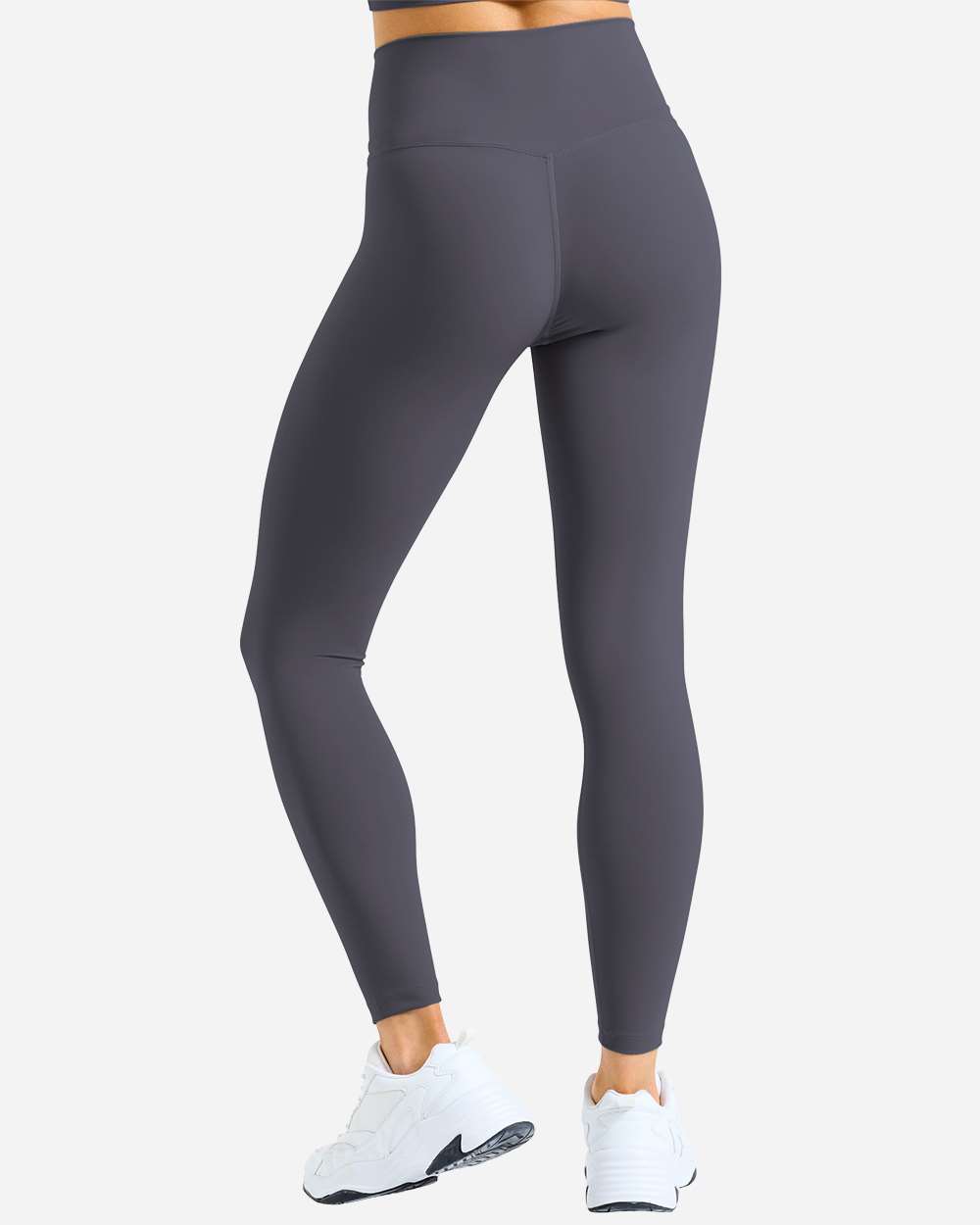 Model wearing custom leggings in Charcoal from the back, showing the full-length fit and opaque matte fabric