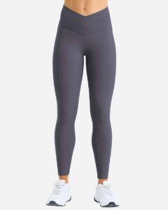 Model wearing custom leggings in Charcoal from the front, showing the high rise and crossover waistband fit