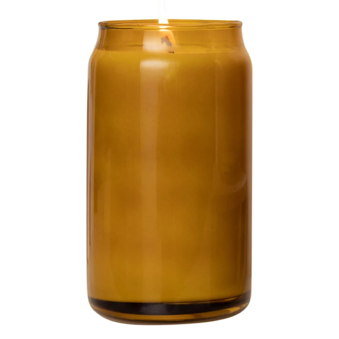 Custom candle in amber 16 oz can glass filled with soy wax, lit