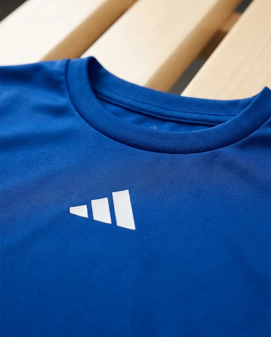 Custom Adidas shirts for women close-up, Team Royal recycled polyester knit, rib collar and adidas chest badge