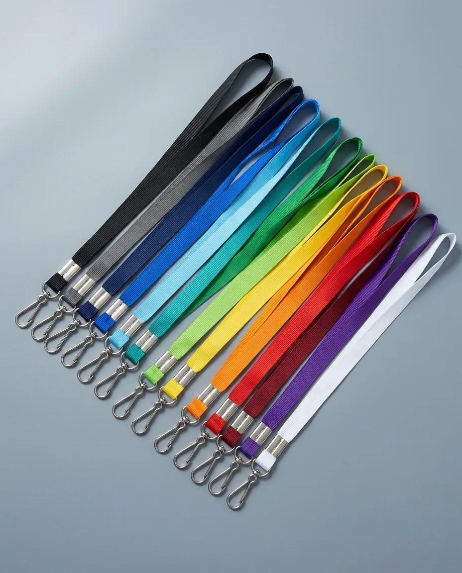 Custom lanyards in fifteen strap colors laid in a fan, 3/4 inch polyester straps with silver j-hooks