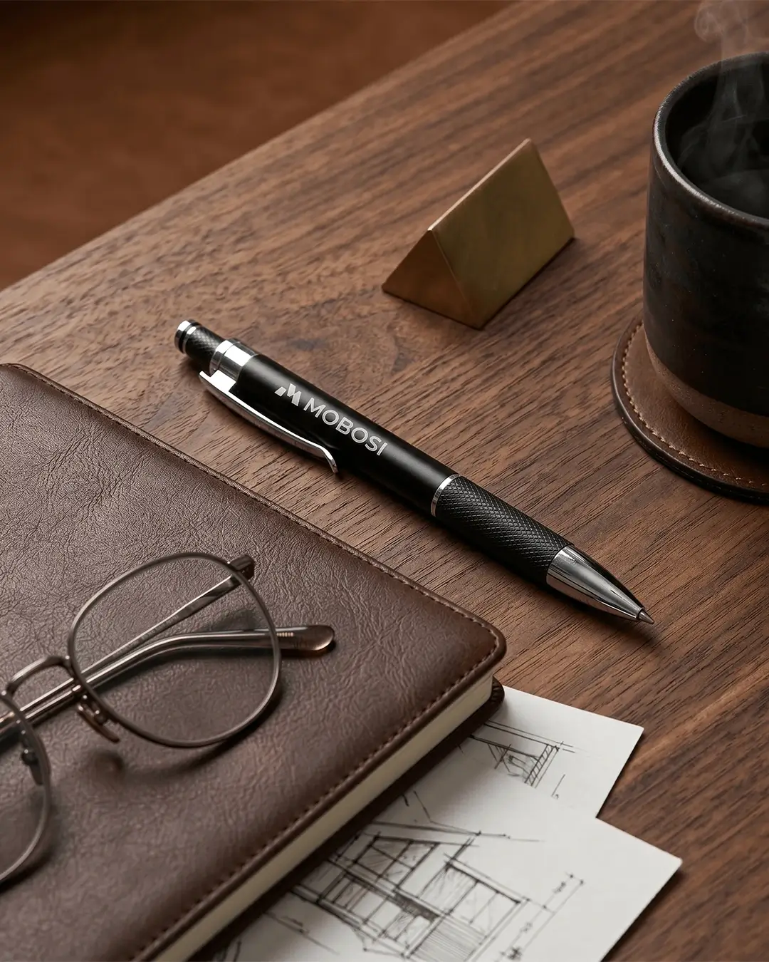 Laser engraved pen with a diamond-etched knurled grip in hand